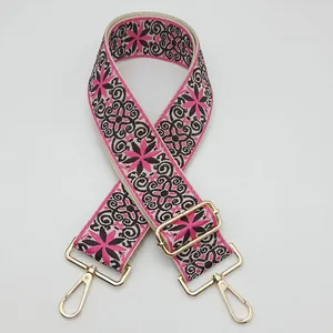 Ethnic embroidery purse strap in pink and black with golden adjustable metal hooks