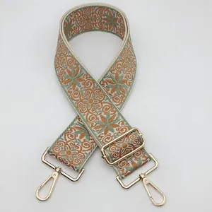 Ethnic style embroidered bag strap in green and orange with gold metal hardware