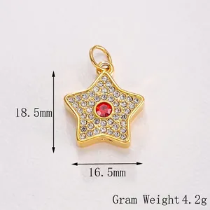 Detailed view of a gold star pendant featuring a red gemstone and white crystal inlay