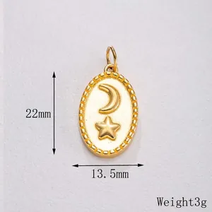 Macro detail of gold celestial crescent moon and star oval pendant, size 22mm x 13.5mm