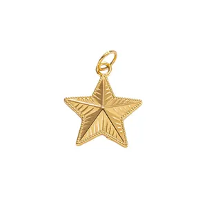 Golden star pendant made of stainless steel with vintage textured radial pattern details