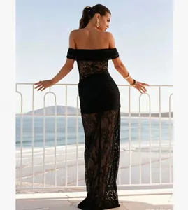 Detail of elegant off-shoulder black lace evening gown with transparent floral patterns
