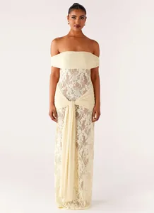 Detail of off-shoulder lace dress featuring cross-drape fabric and floral embroidery
