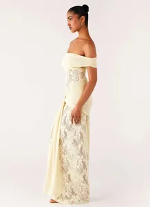 Detailed close-up of off-the-shoulder lace evening gown with elegant side drape and texture