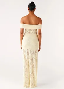 Detail of off-shoulder lace maxi dress back view showing intricate floral embroidery texture