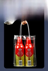 Strong clear PVC gift bag with snap button showing load-bearing capacity for bottles