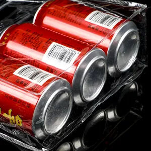 Close-up of a clear PVC gift bag holding six cans to show capacity and transparency