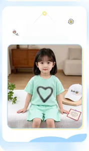 Dettaglio completo estivo da bambina verde menta con stampa a cuore e cotone morbido