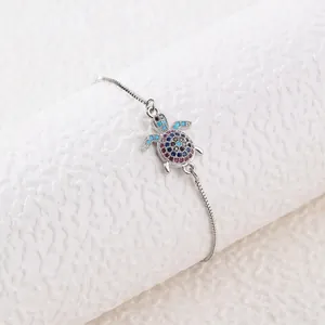 Colorful zircon turtle bracelet featuring a sea turtle pendant on a silver box chain