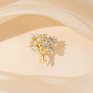 Elegant gold-plated flower bouquet brooch with white pearls and sparkling zircon accents