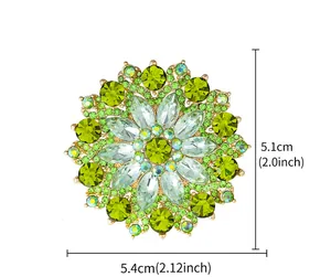 Detail view of sunflower brooch with green crystals and gold base showing dimensions