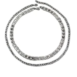 Two silver curb chains in different thicknesses made of polished stainless steel
