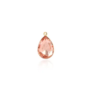 Detailed macro view of pear-shaped champagne zircon pendant with 18K gold plated frame