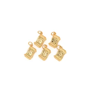 Five 18K gold-plated dollar sign money stack pendants on a clean white background