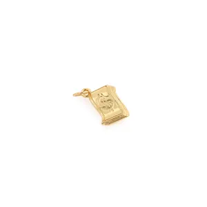 Macro detail of 18K gold plated money stack pendant featuring embossed dollar sign