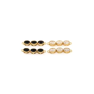 Detailed view of 18K gold plated connectors with black and white zircon stone rows
