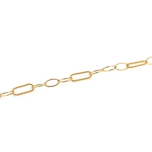 Detail of 18K gold-plated DIY jewelry chain with smooth oval and twisted spiral links