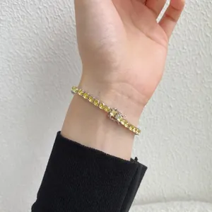 S925 sterling silver tennis bracelet with 4mm yellow zirconia worn on a wrist