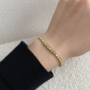 Detail of 4mm S925 sterling silver tennis bracelet with round yellow zircon stones