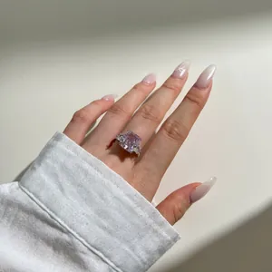 Macro shot of a 6-carat rose pink rectangular gemstone on an S925 silver ring band
