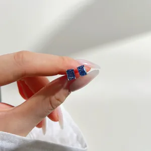 925 silver stud earrings featuring deep blue ice-cut zircon stones in classic four-prong setting