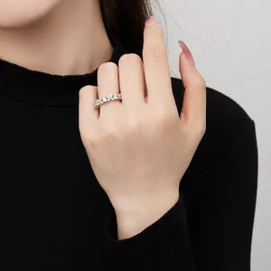Elegant S925 sterling silver ring with marquise cut gems worn on a woman's finger
