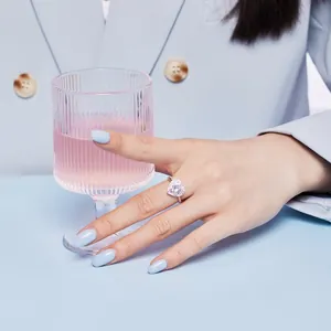 Close-up of heart-shaped zircon ring worn by a model in a refined lifestyle setting