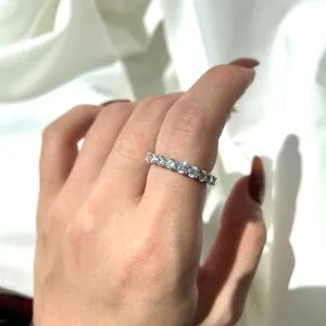 Macro view of a classic S925 sterling silver half eternity ring with cubic zirconia