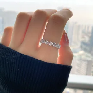 Close-up of S925 sterling silver ring featuring heart-shaped cubic zirconia on model hand