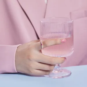 S925 silver ring with gradient rectangular colorful zircons worn by model on pink background