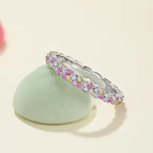 Detail of silver S925 ring with colorful rainbow cubic zirconia and wavy edges