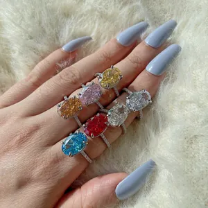 Close-up of luxury S925 silver rings with large colorful oval zircon gemstones on fur