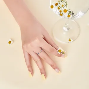 Detail of S925 silver ring featuring colorful zircon crystals on model's hand