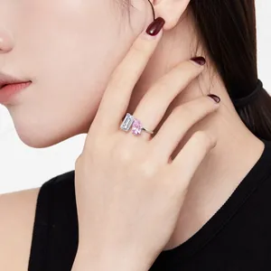 S925 sterling silver ring featuring emerald-cut clear and pear-cut pink cubic zirconia