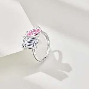 S925 sterling silver ring featuring a pink pear-cut and white emerald-cut double stone