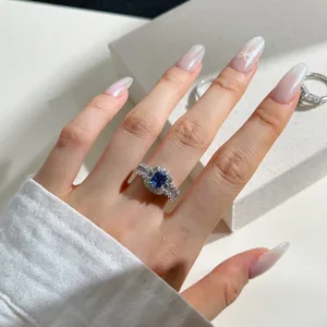 Detailed close-up of a 925 silver ring featuring a radiant blue square-cut gemstone