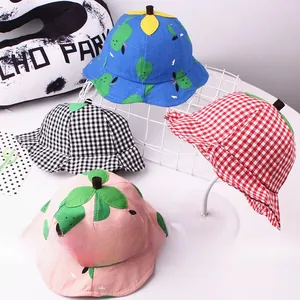 Close-up of four kids bucket hats in plaid and leaf patterns with cute 3D stem details