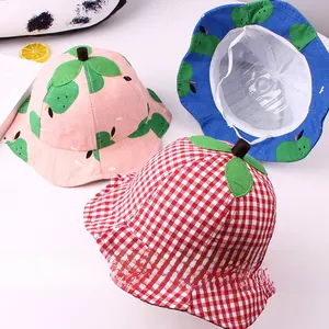 Detail of baby sun hats featuring leaf accents, fruit prints, and adjustable chin straps