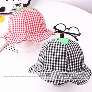 Top view of kids plaid bucket hat with creative green leaf apple stem decoration