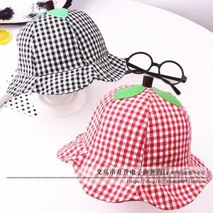 Detail of plaid cotton sun hats for toddlers featuring creative 3D leaf and stem design
