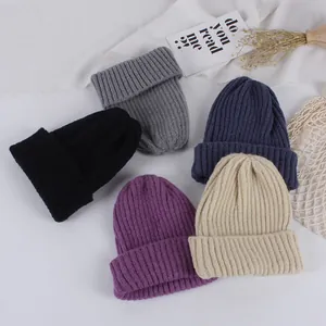 Winter ribbed knit baby beanies featuring cartoon dog design and soft double pompoms