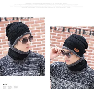 Detailed view of black knitted beanie and neck warmer set with thick grey fleece lining