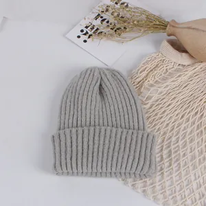 Detail of grey ribbed knit beanie for children with warm wool texture and cuff style