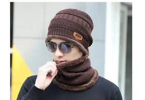 Detail of dark coffee knitted beanie and neck warmer set with thick fleece lining