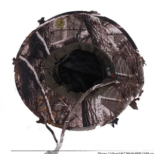 Detail of 3D leaf camouflage hat with breathable mesh lining and adjustable wind rope