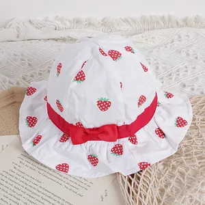 Sweet cotton sun hat for girls with red strawberry print and bow tie detail