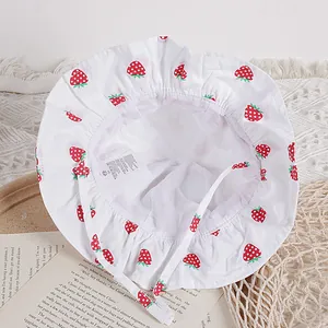 White cotton baby sun hat with strawberry print and breathable mesh lining