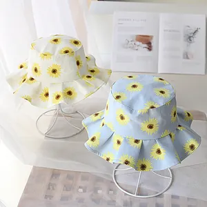 Sombrero de sol para niños con girasoles y ala con volantes en algodón beige y azul