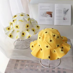 Sombreros de sol para niños con estampado de girasol y ala rizada crema y amarillo