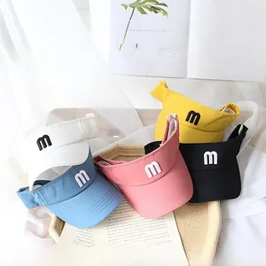 Close-up of five colorful breathable sun visors featuring a small embroidered letter m